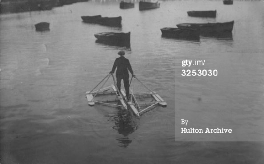circa 1920 A man in the Channel using a floating contraption that allows him to walk on the water